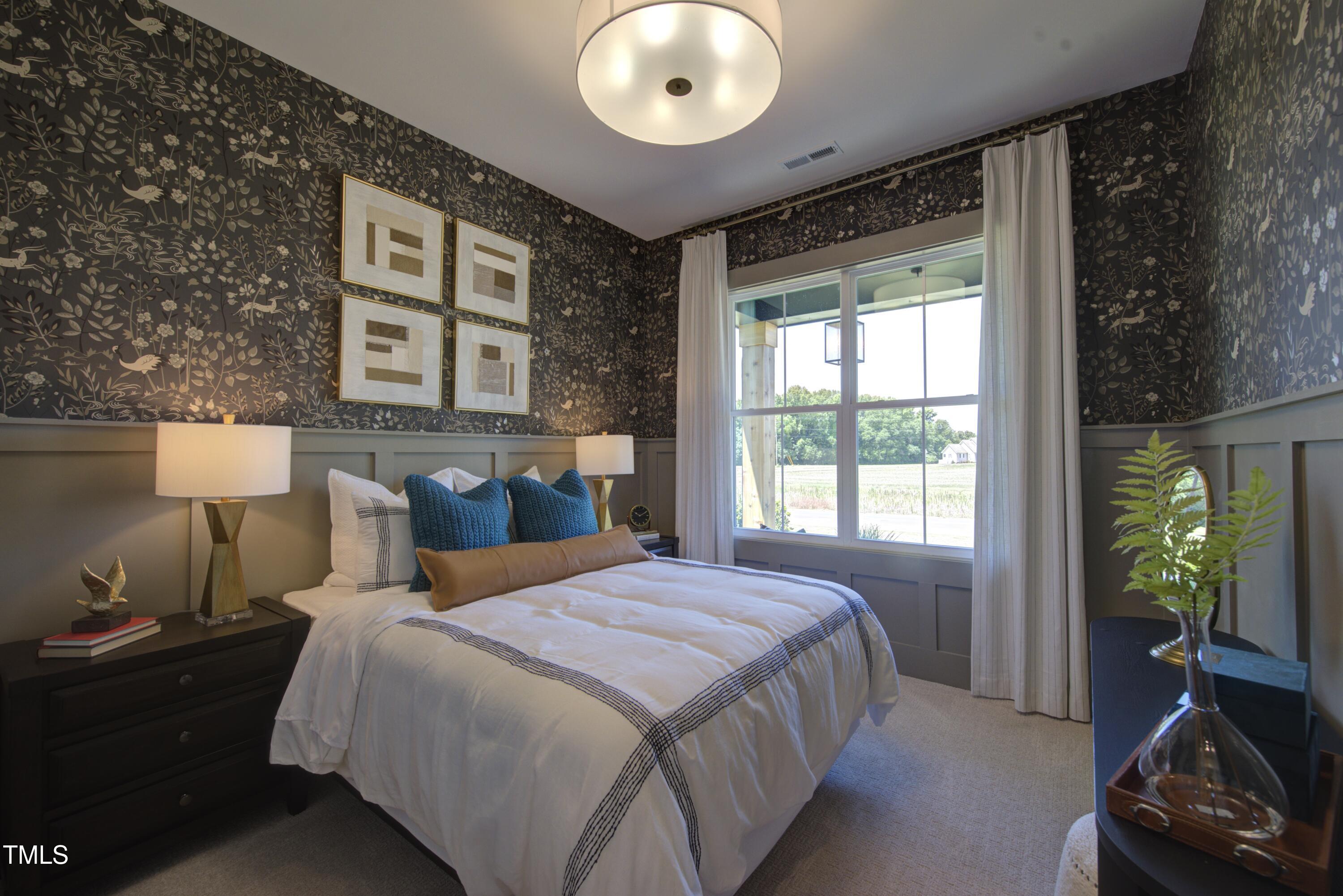 306 Golden Leaf Farms Road Angier, NC 27501 - Photo 17 of 21 a bedroom with a bed and a window