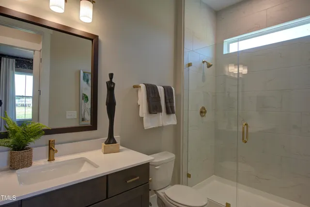 a bedroom with a bed and a mirror