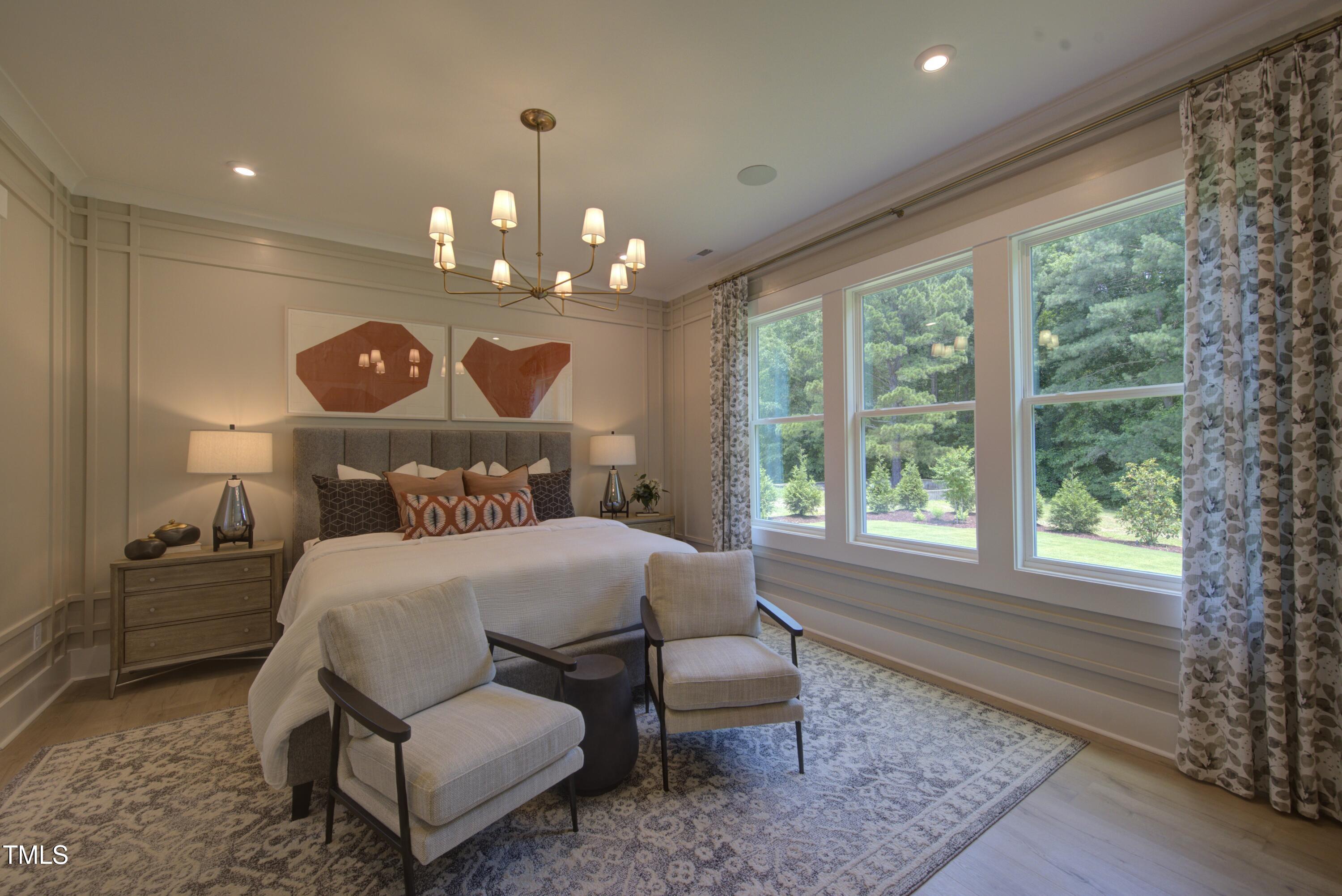 306 Golden Leaf Farms Road Angier, NC 27501 - Photo 5 of 21 a bedroom with a bed and window