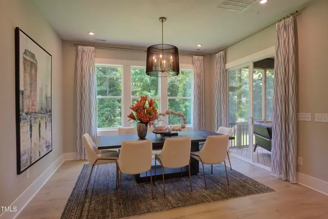 a work room with furniture and a potted plant