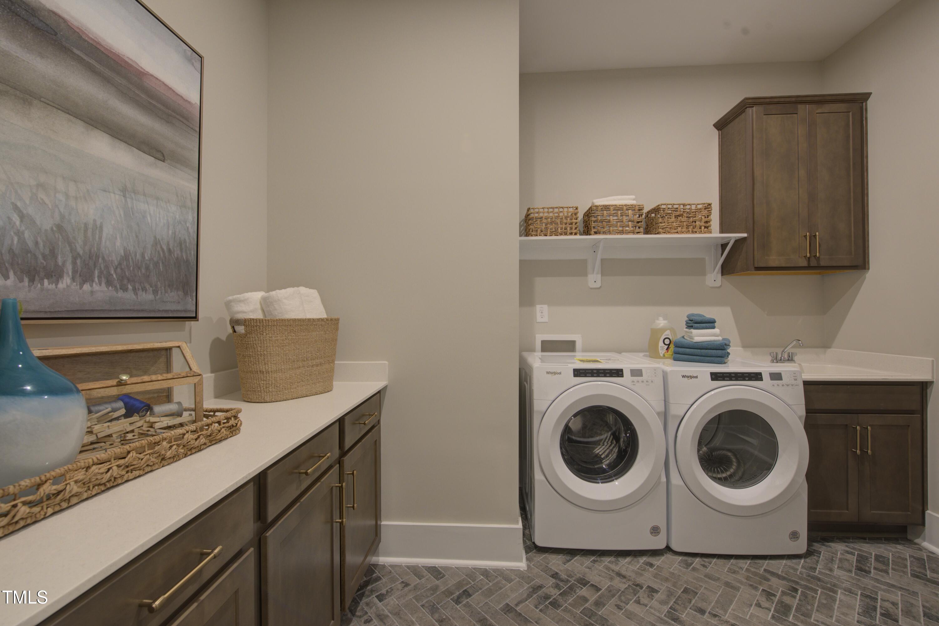 306 Golden Leaf Farms Road Angier, NC 27501 - Photo 8 of 21 a utility room with sink dryer and washer