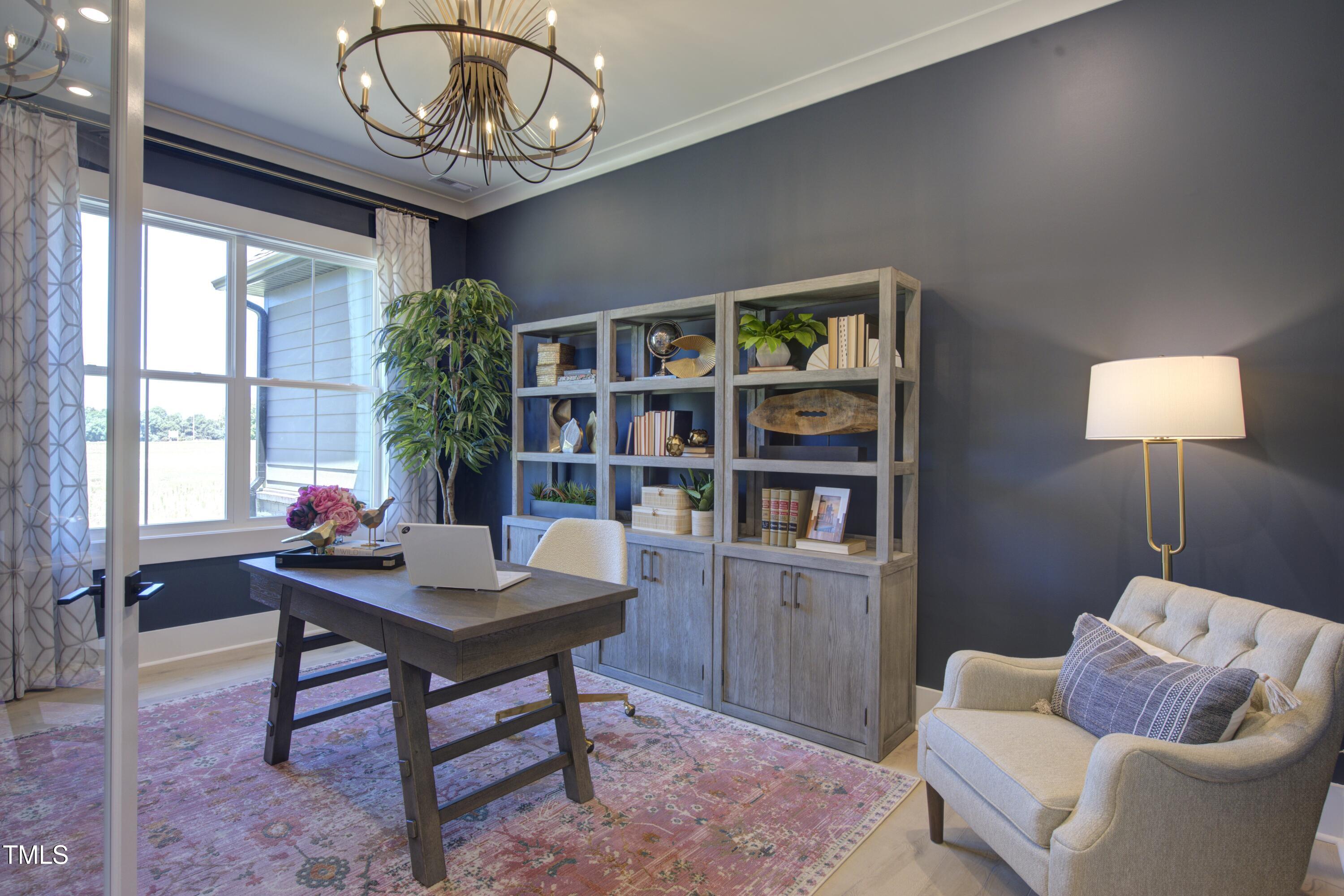 306 Golden Leaf Farms Road Angier, NC 27501 - Photo 9 of 21 a work room with furniture and a potted plant
