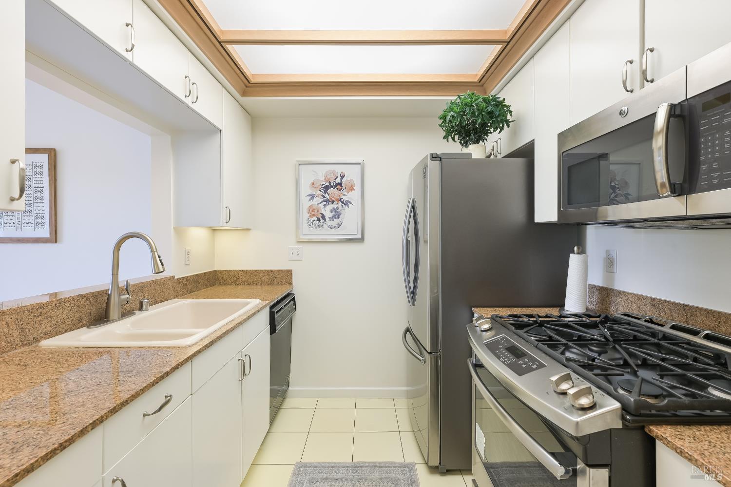 600 Deer Valley Road, Unit 3E San Rafael, CA 94903 - Photo 2 of 18 a kitchen with stainless steel appliances granite countertop a sink stove and refrigerator