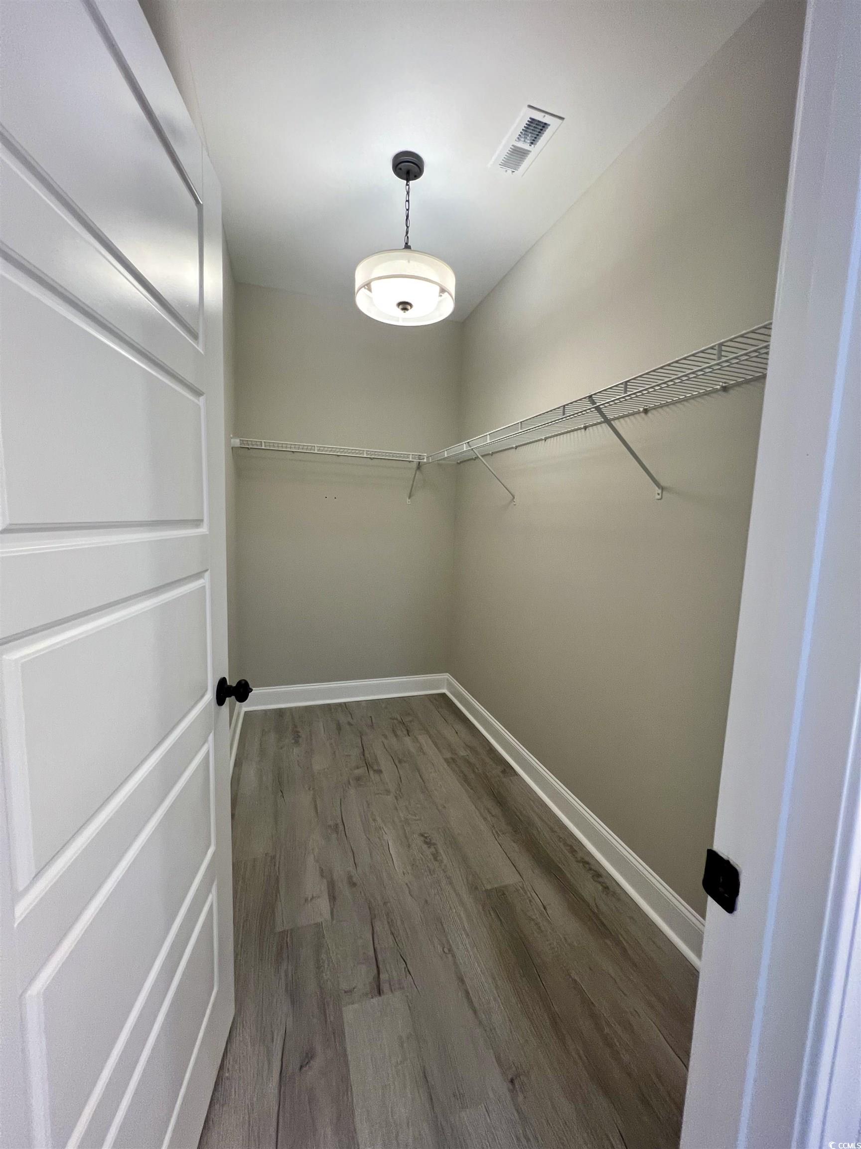 1107 Highway 9 Business Loris, SC 29569 - Photo 26 of 33 Spacious closet featuring dark wood-type flooring