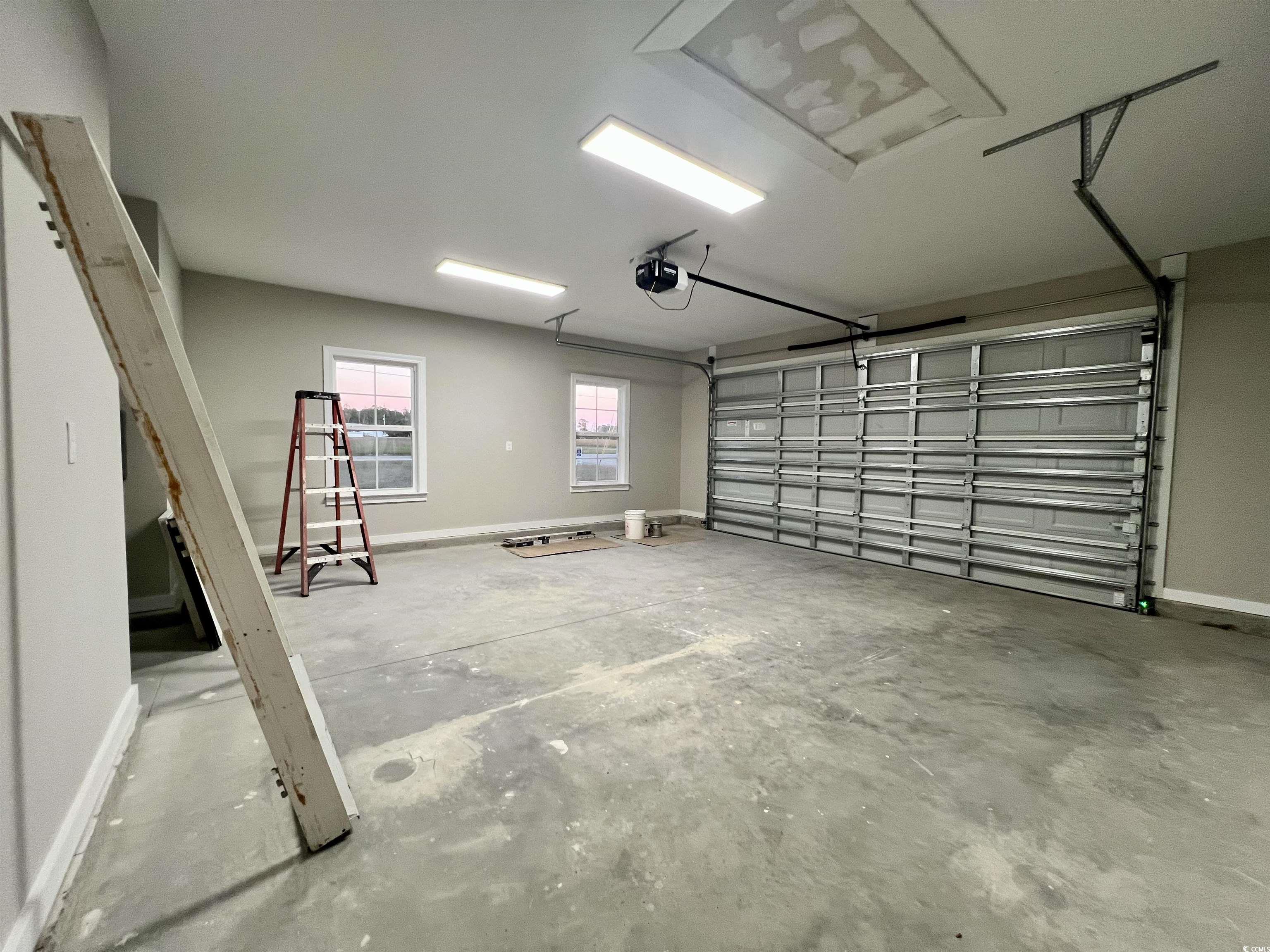 1107 Highway 9 Business Loris, SC 29569 - Photo 29 of 33 Garage featuring a garage door opener