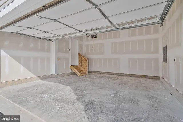 an empty room with windows and bathroom