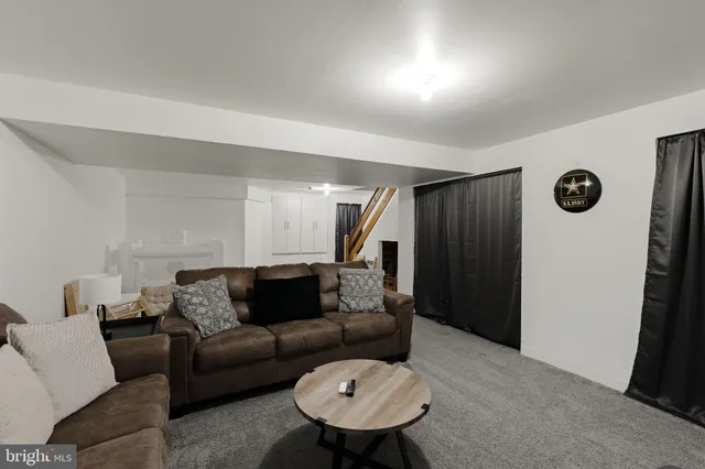 a view of a livingroom with an empty space and a window