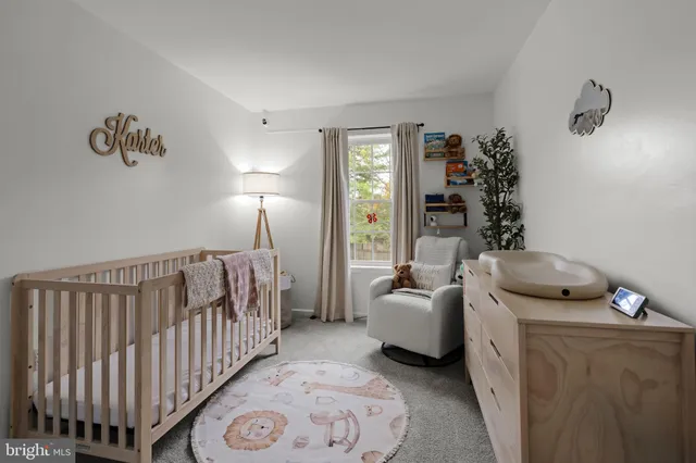 a livingroom with workspace and a couch