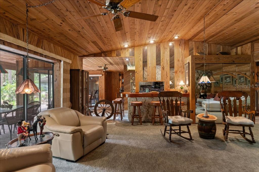 935 Ranch Road Tarpon Springs, FL 34688 - Photo 14 of 40 a living room with furniture and a large window