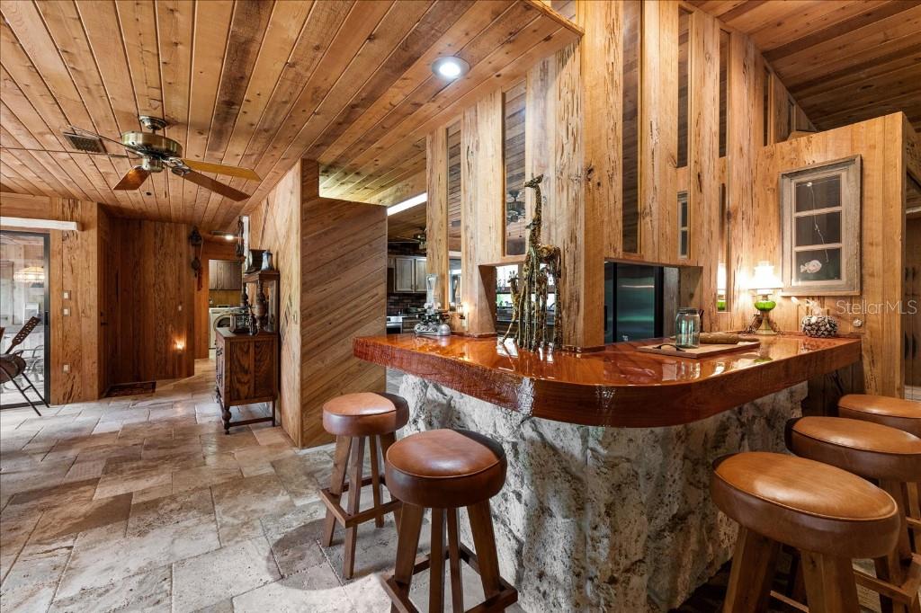 935 Ranch Road Tarpon Springs, FL 34688 - Photo 15 of 40 a view of a room with furniture and chandelier