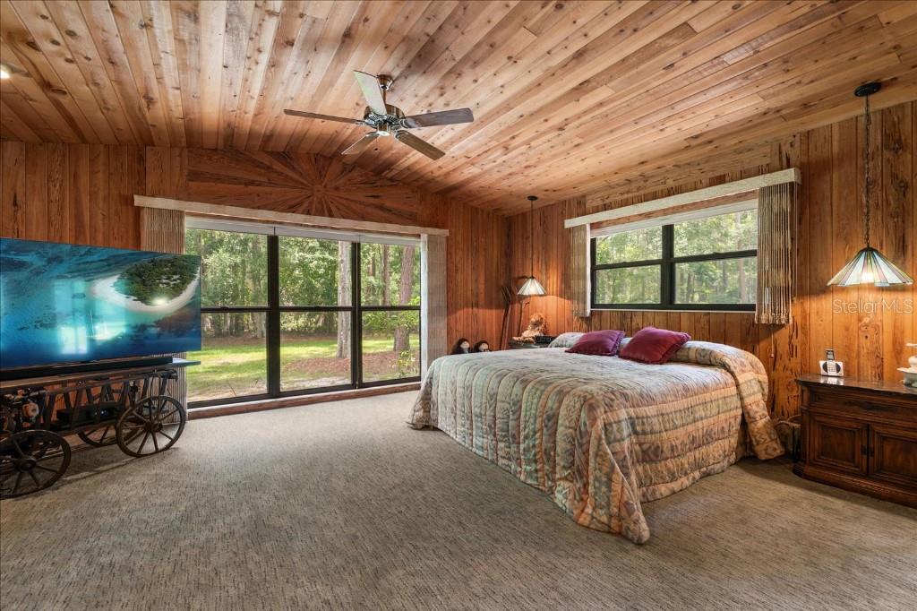 935 Ranch Road Tarpon Springs, FL 34688 - Photo 21 of 40 a bed sitting in a bedroom next to a window