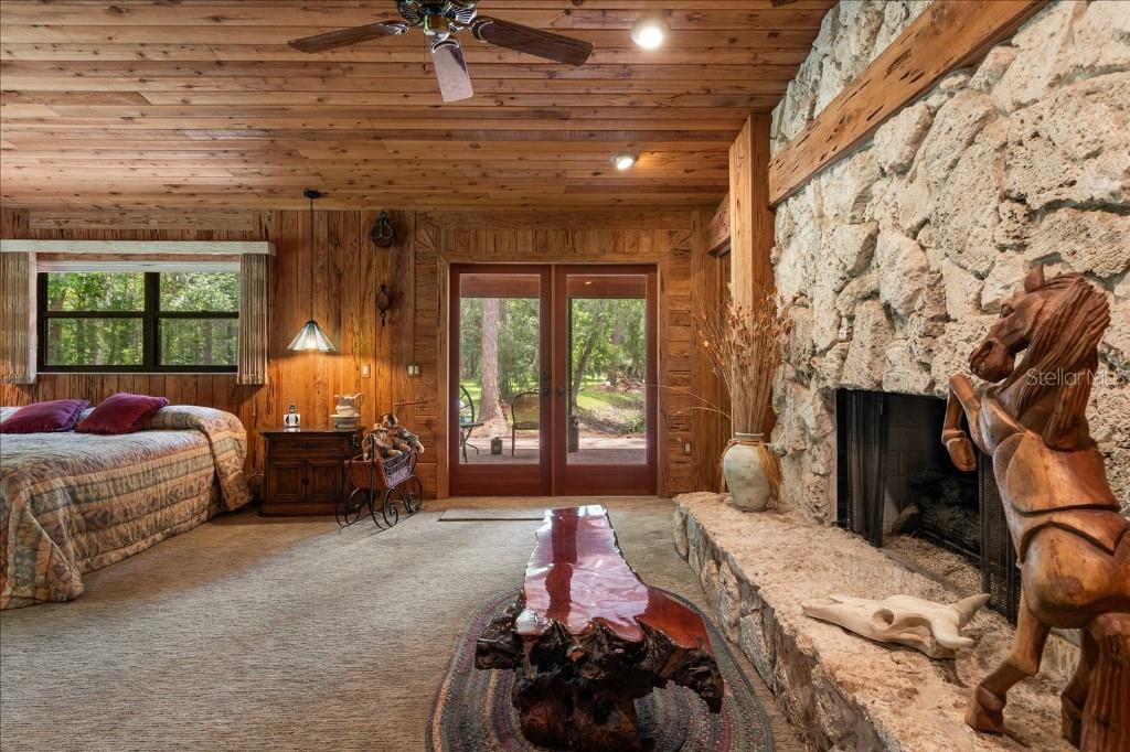 935 Ranch Road Tarpon Springs, FL 34688 - Photo 22 of 40 a bedroom with bed and wooden floor