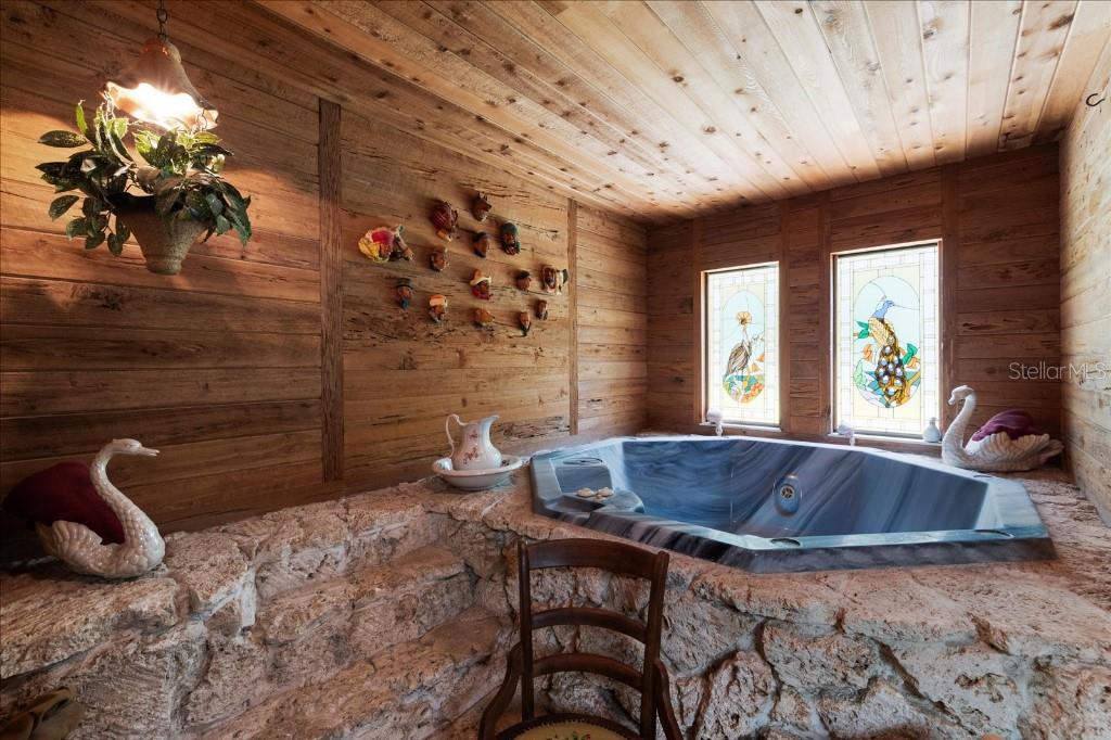 935 Ranch Road Tarpon Springs, FL 34688 - Photo 24 of 40 a dining room with furniture and window