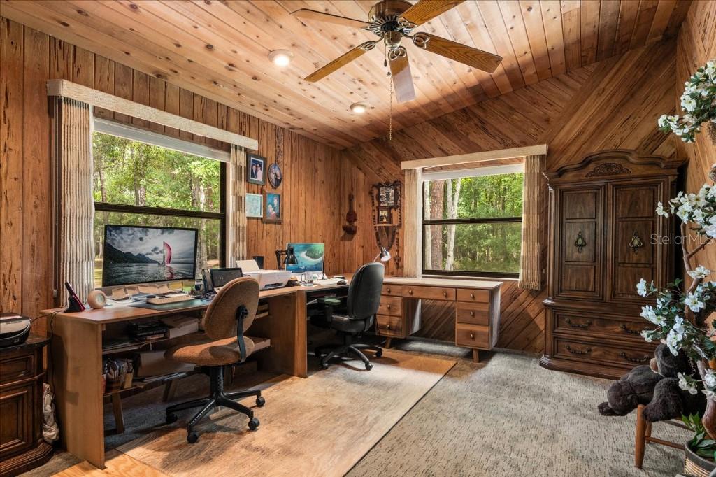 935 Ranch Road Tarpon Springs, FL 34688 - Photo 25 of 40 a view of a workspace with furniture and a window