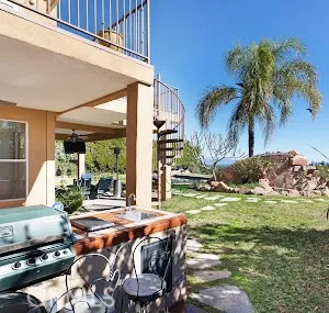 a view of a house with swimming pool yard and outdoor seating