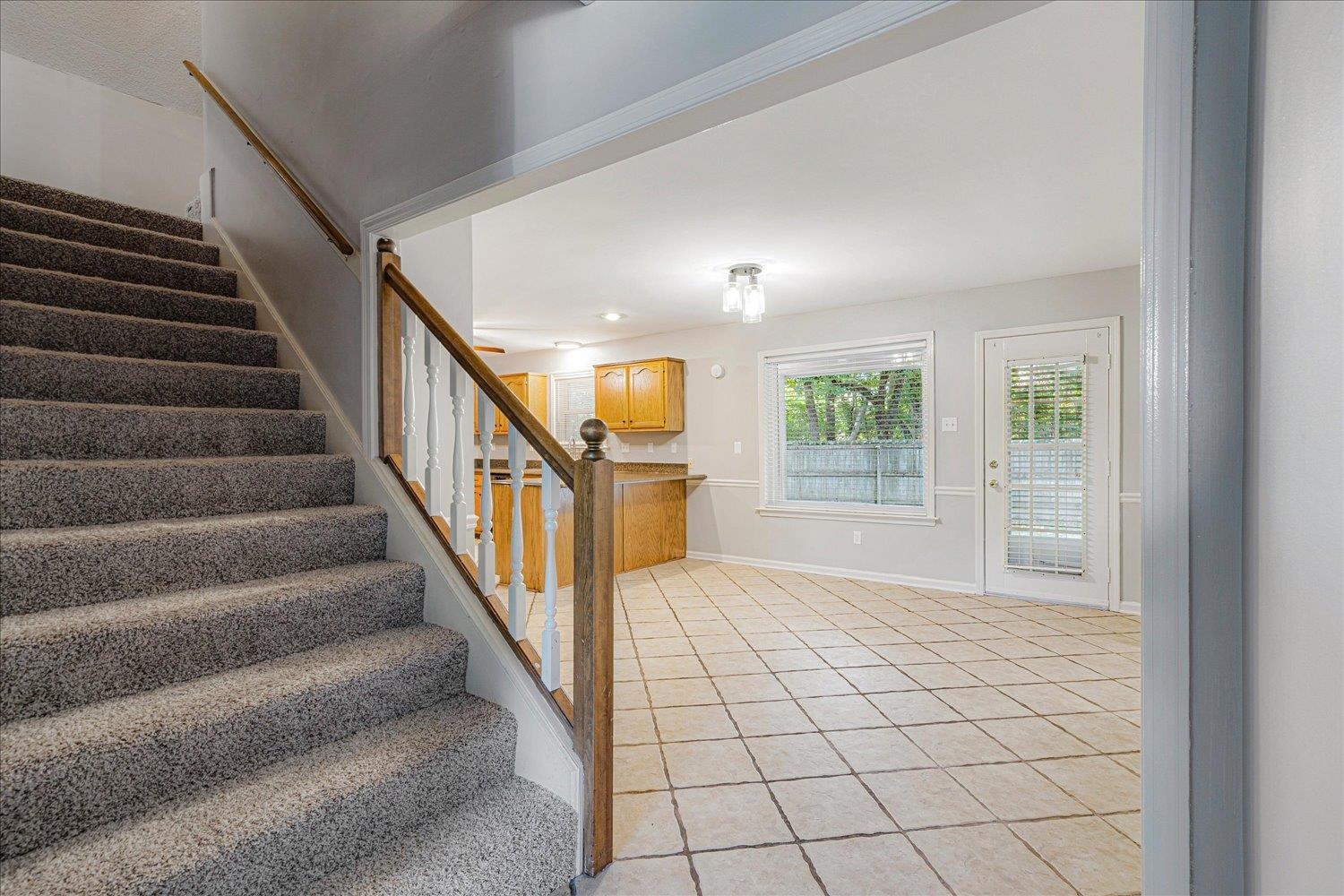 910 Sugar Cove Collierville, TN 38017 - Photo 17 of 32 Stairs with tile patterned flooring and baseboards