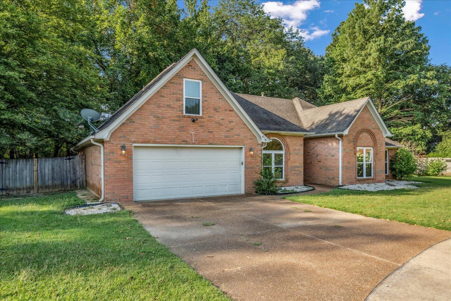 910 Sugar Cove Collierville, TN 38017 - Photo 2 of 32 View of front of property featuring brick siding, driveway, a shingled roof, and an attached garage