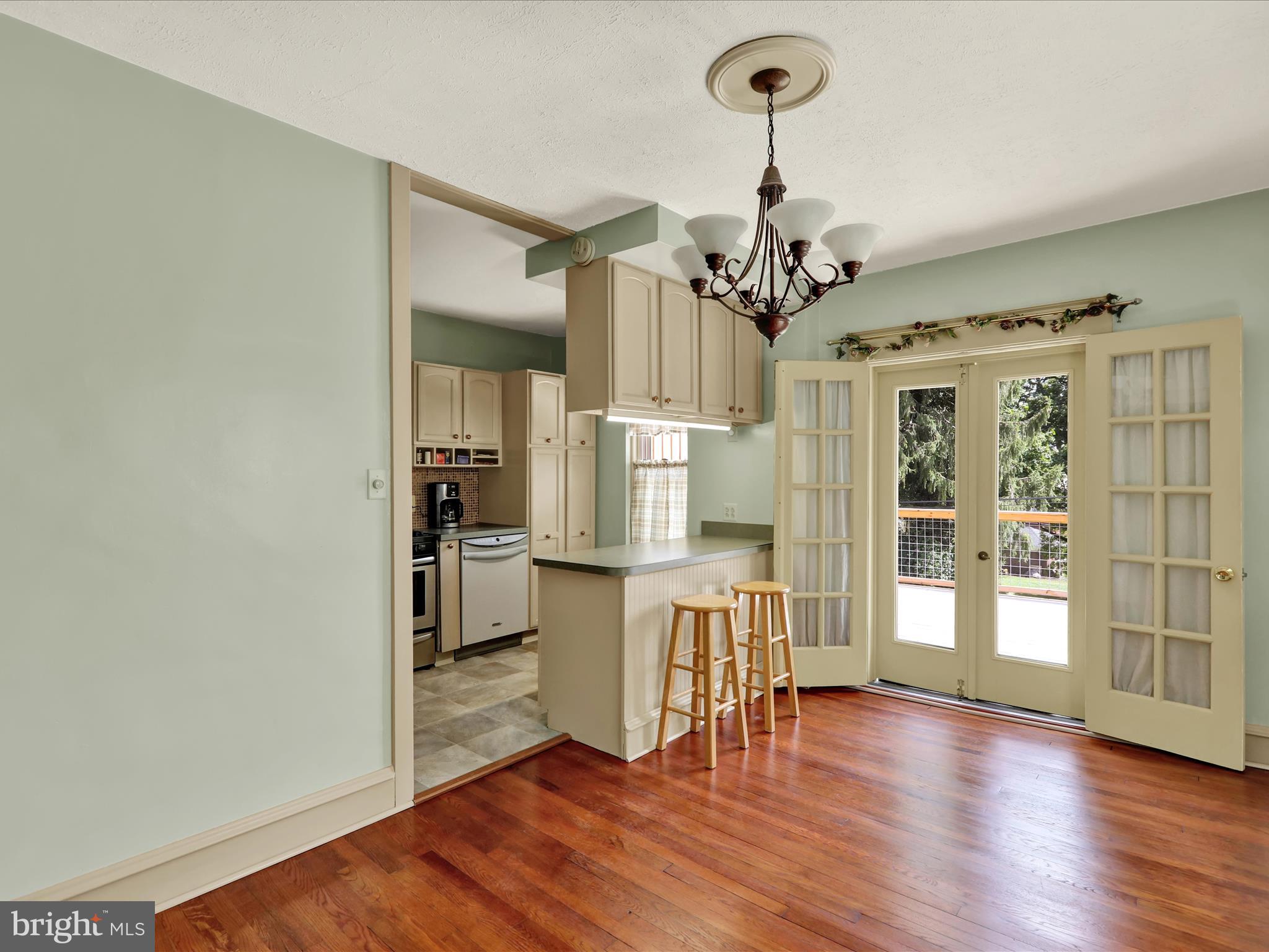 519 Friedensburg Road Reading, PA 19606 - Photo 11 of 47 a view of a kitchen with wooden floor and a refrigerator