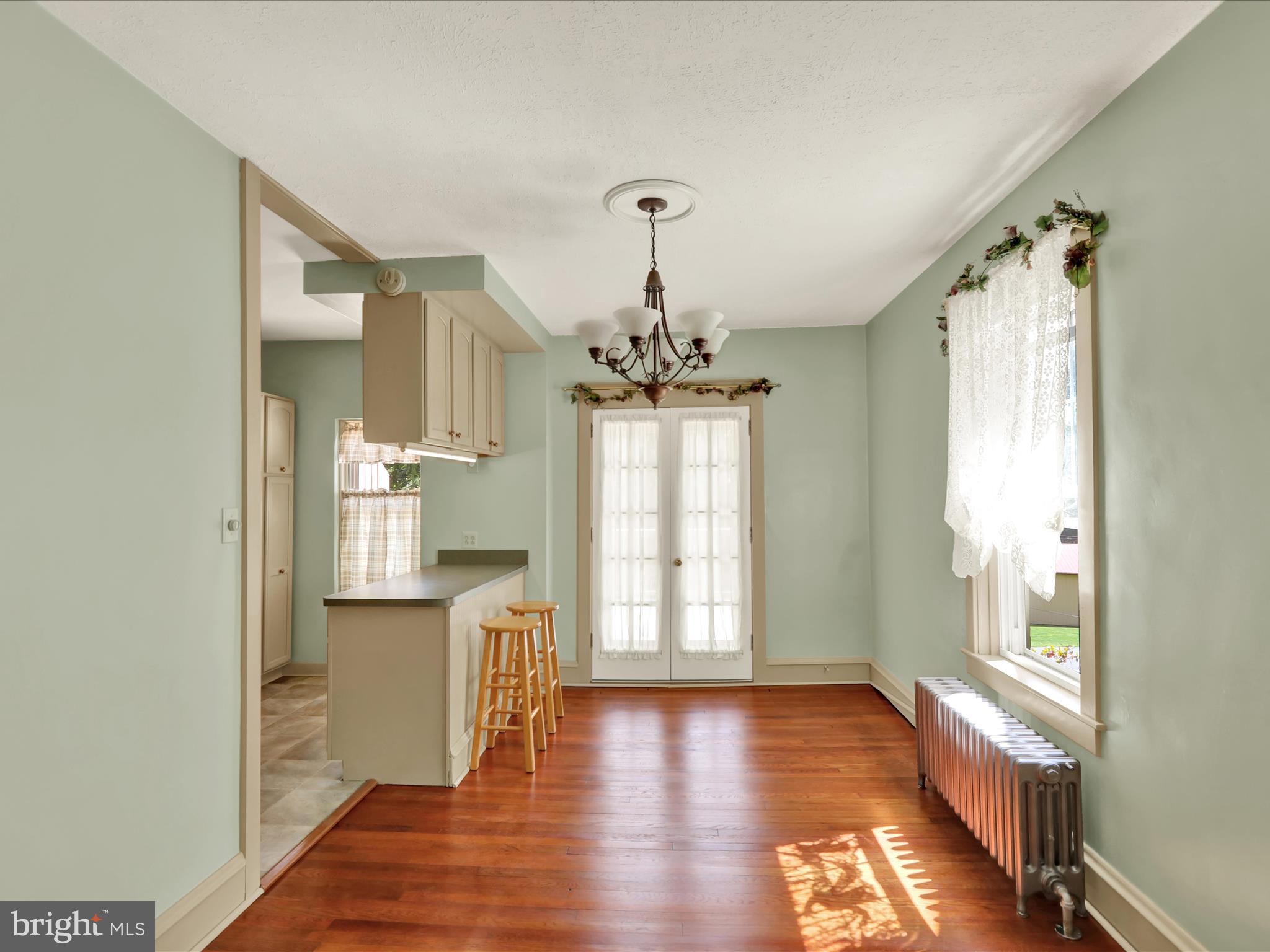 519 Friedensburg Road Reading, PA 19606 - Photo 12 of 47 a view of a hallway with wooden floor and a chandelier
