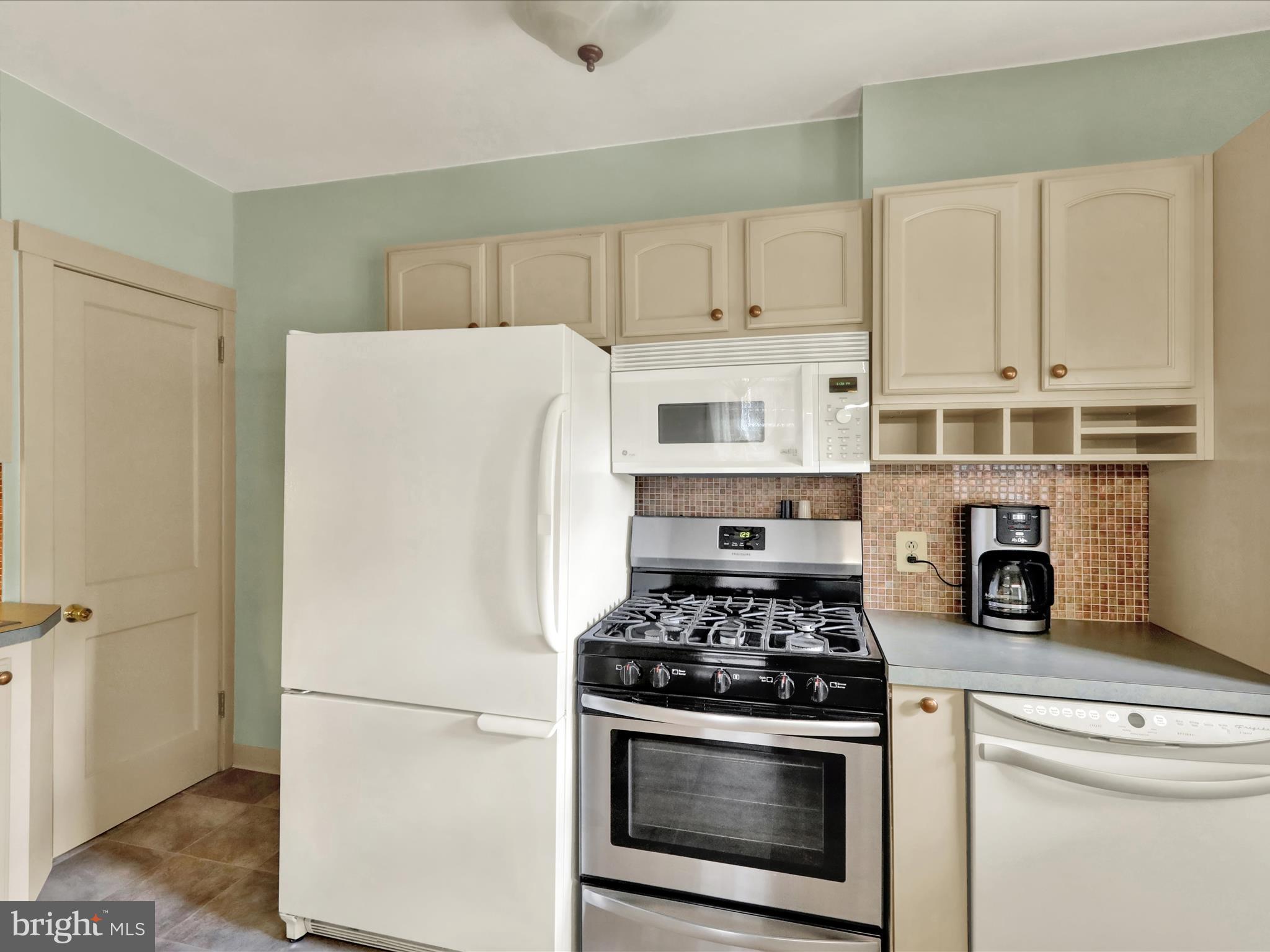 519 Friedensburg Road Reading, PA 19606 - Photo 14 of 47 a white refrigerator freezer and a stove sitting inside of a kitchen