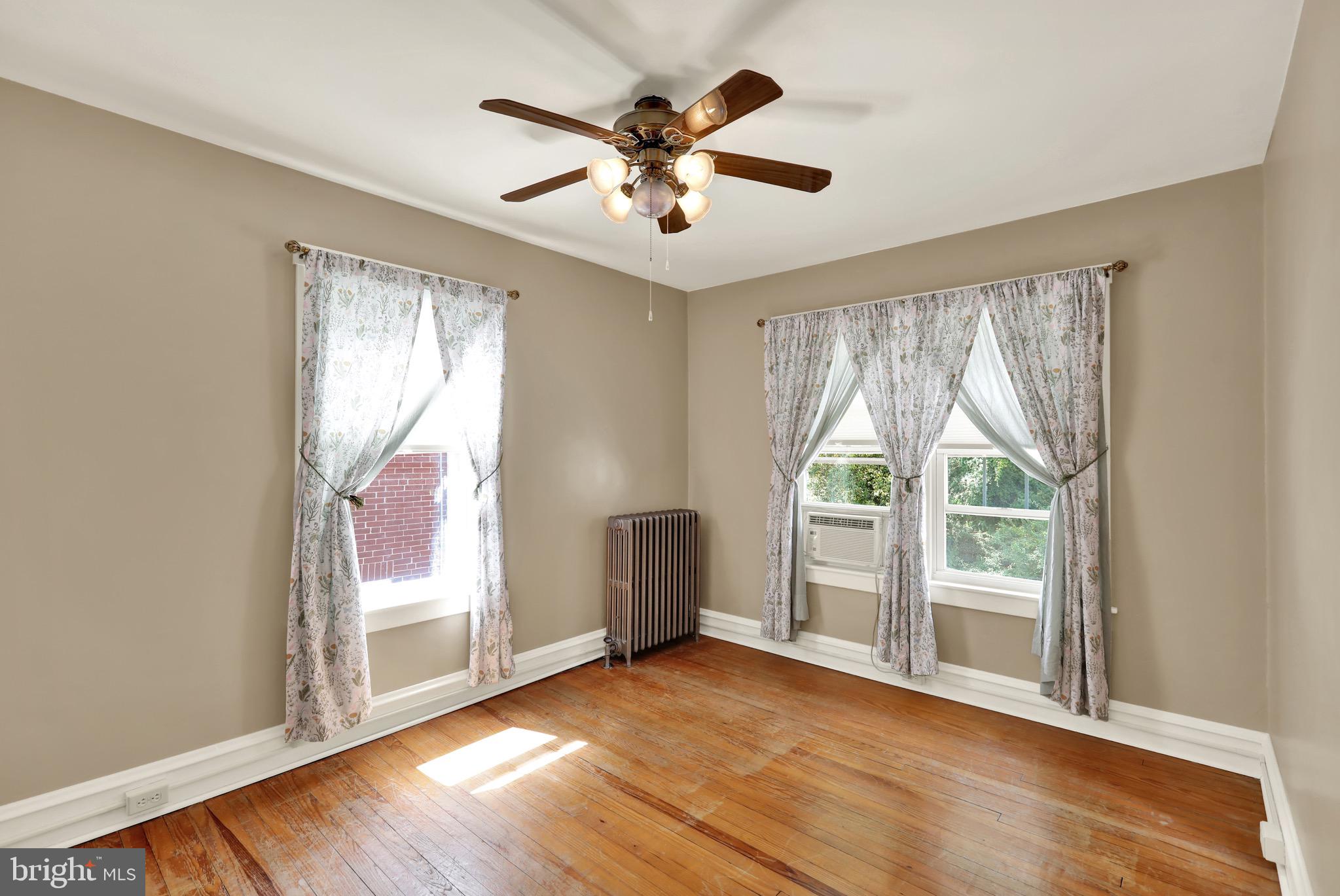 519 Friedensburg Road Reading, PA 19606 - Photo 25 of 47 wooden floor in an empty room with a window