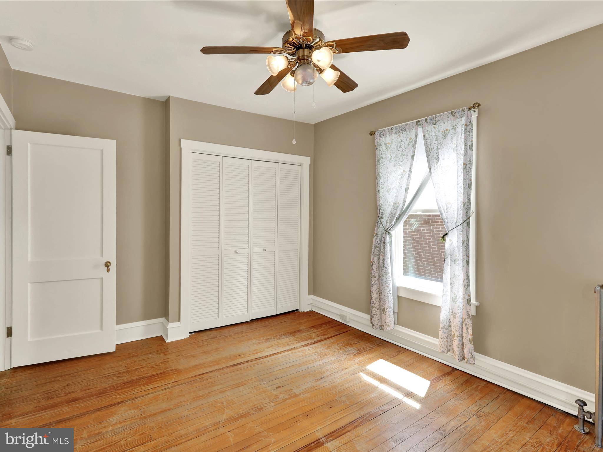 519 Friedensburg Road Reading, PA 19606 - Photo 27 of 47 wooden floor in an empty room with a window