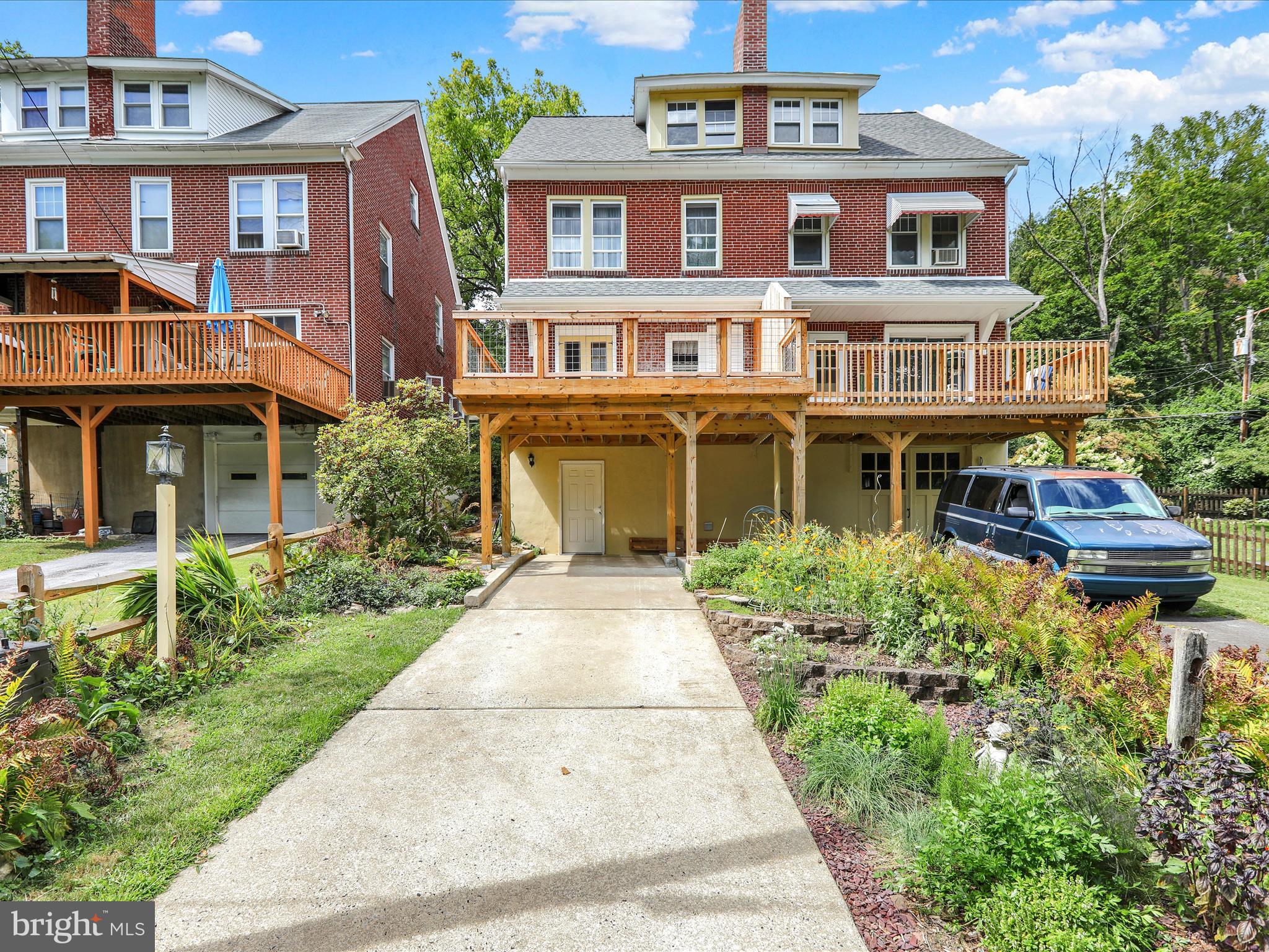 519 Friedensburg Road Reading, PA 19606 - Photo 44 of 47 front view of a brick house with a yard