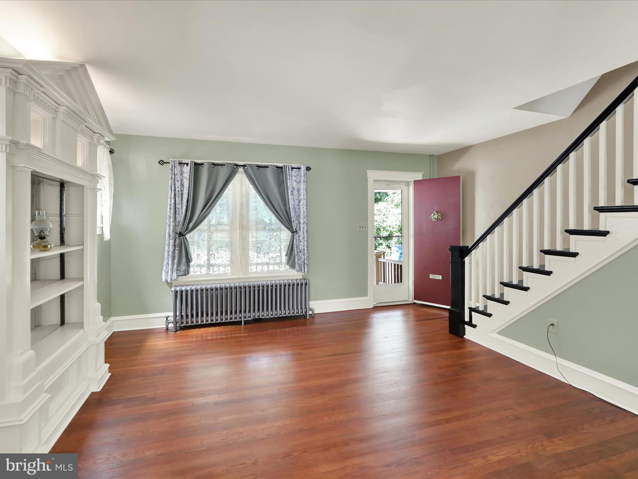 519 Friedensburg Road Reading, PA 19606 - Photo 5 of 47 a view of an empty room with wooden floor and a window