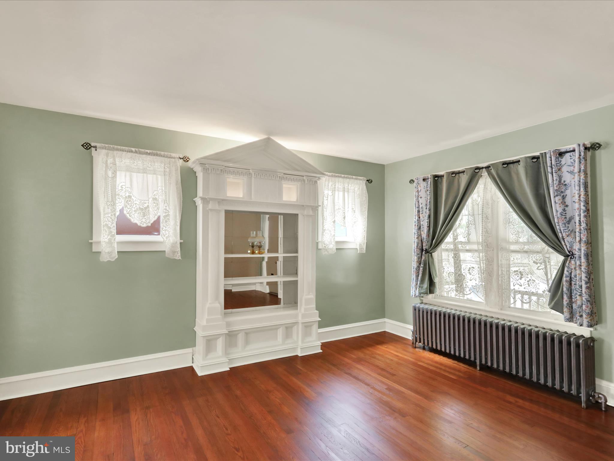 519 Friedensburg Road Reading, PA 19606 - Photo 6 of 47 wooden floor in an empty room with a window