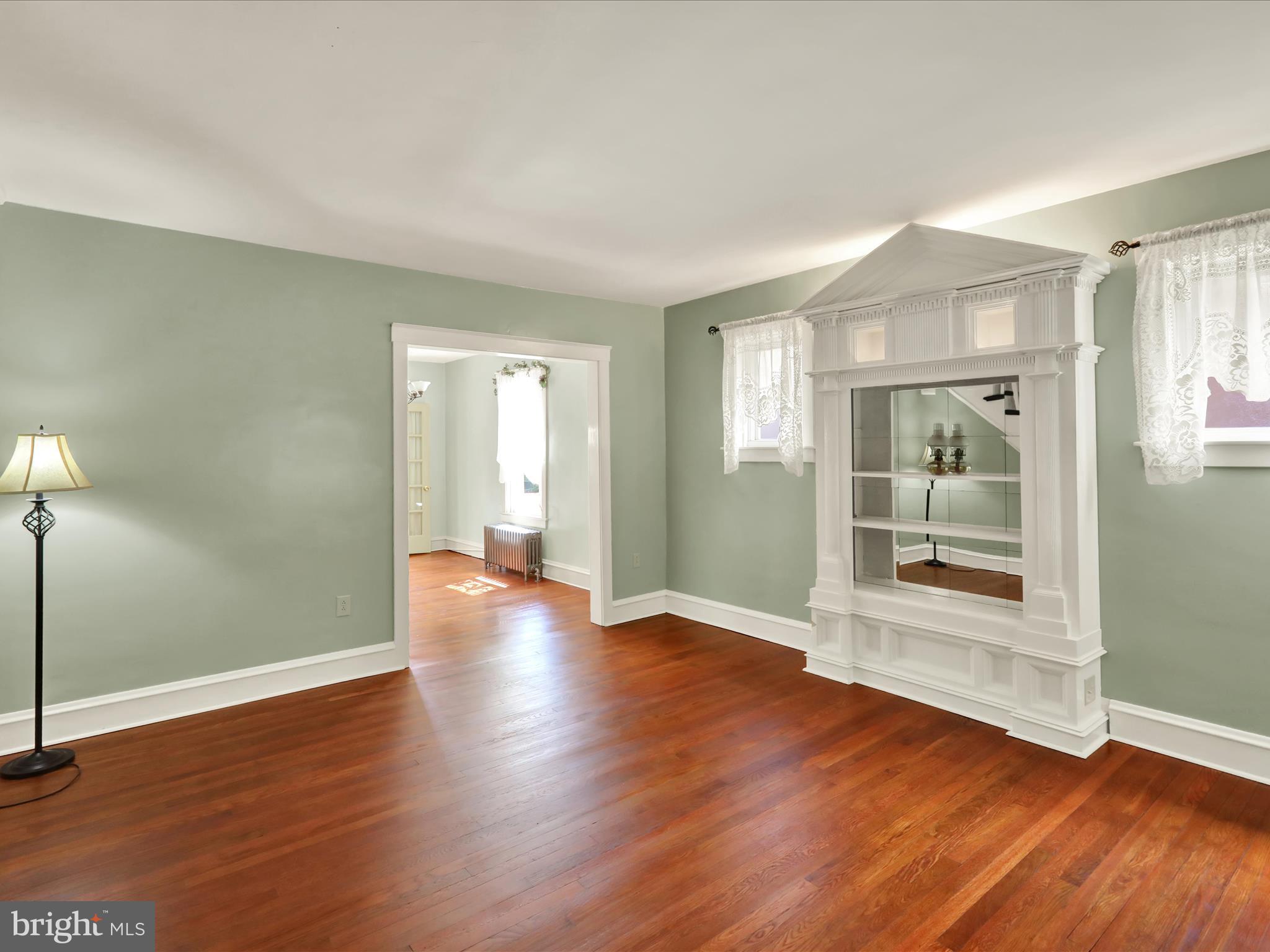 519 Friedensburg Road Reading, PA 19606 - Photo 7 of 47 an empty room with wooden floor and windows