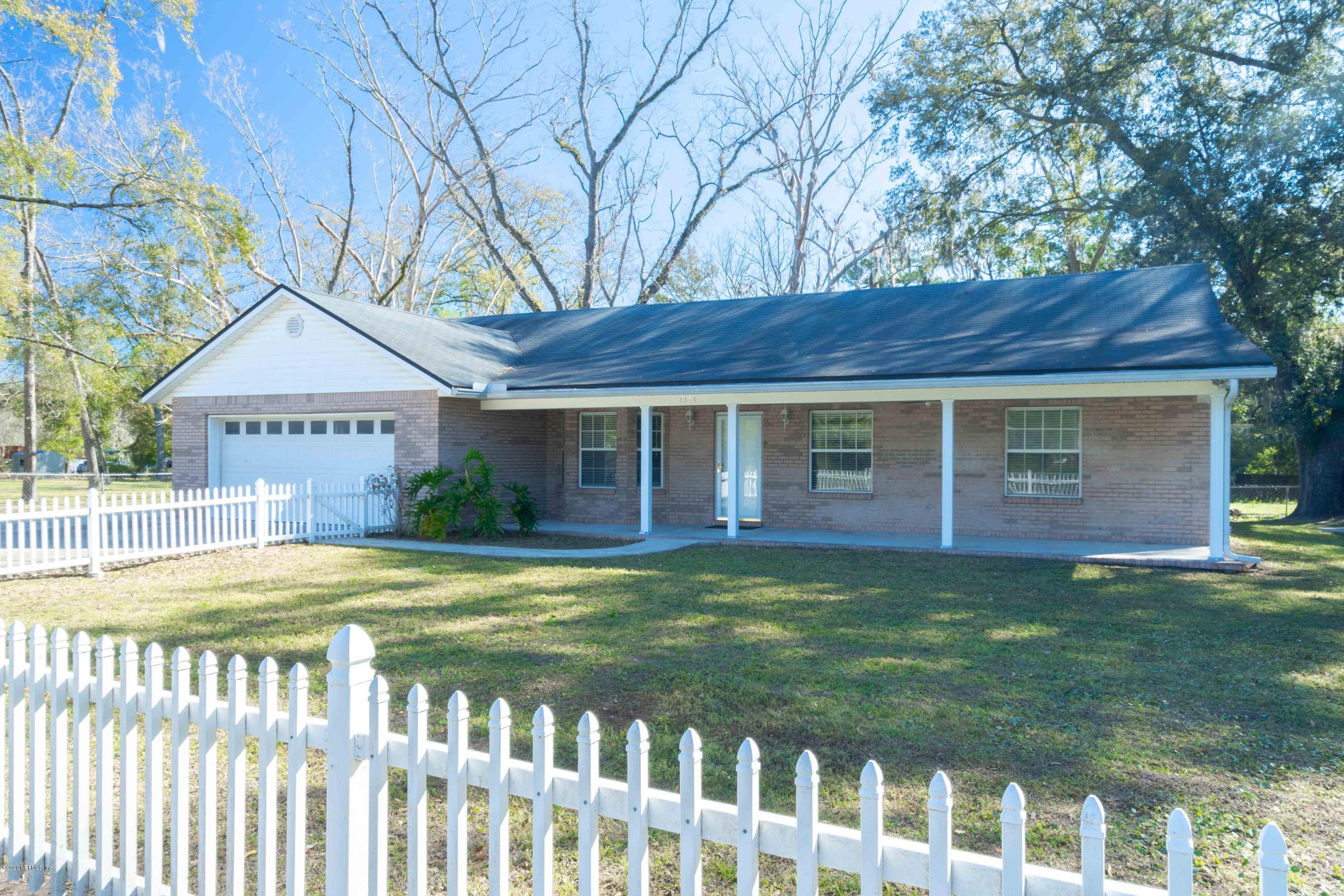 1175 Cahoon Road South Jacksonville, FL 32221 - Photo 1 of 16 a view of a house with a garden