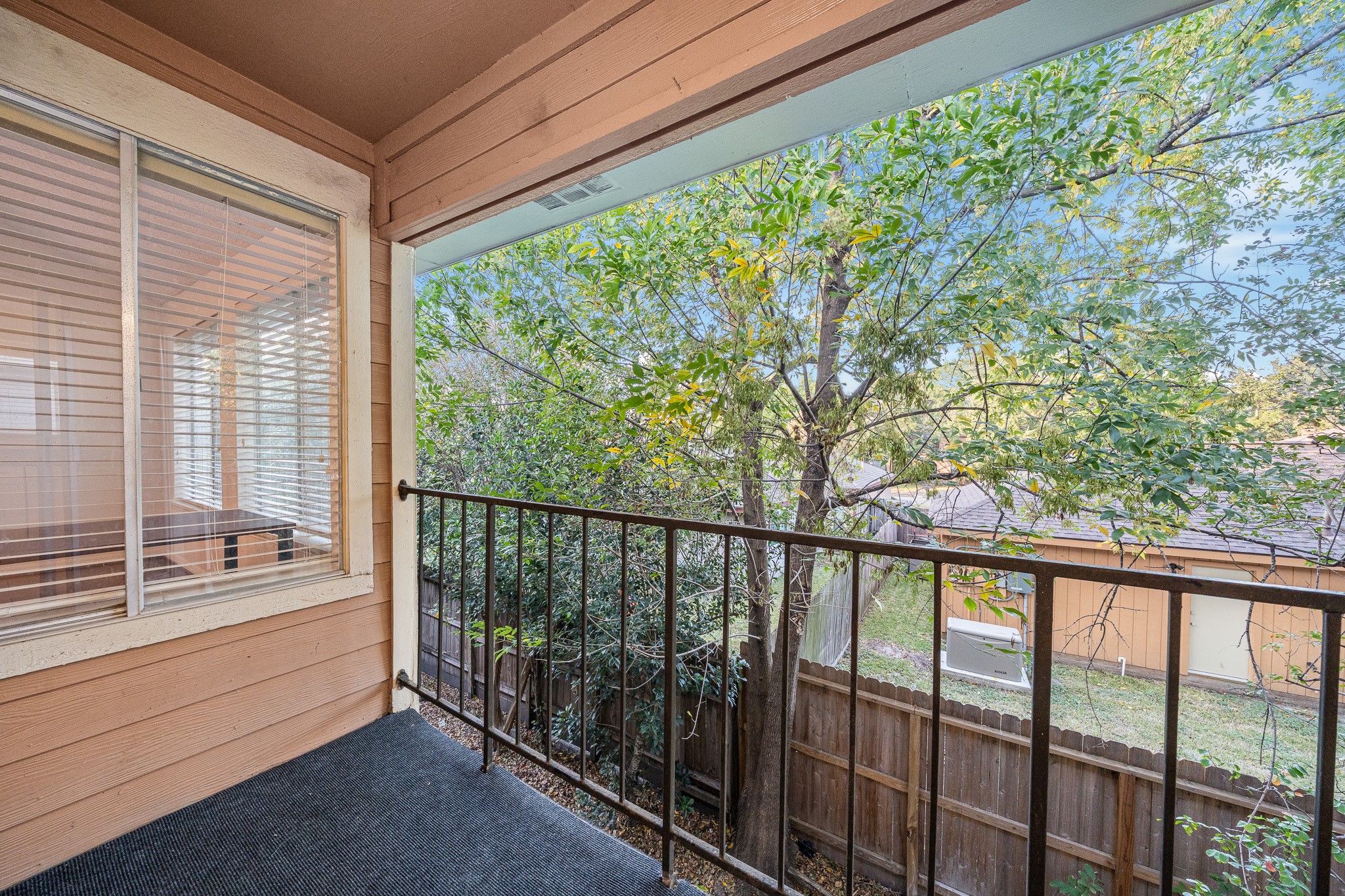 12100 Overbrook Lane, Unit 17D Houston, TX 77077 - Photo 19 of 22 a view of balcony with couch