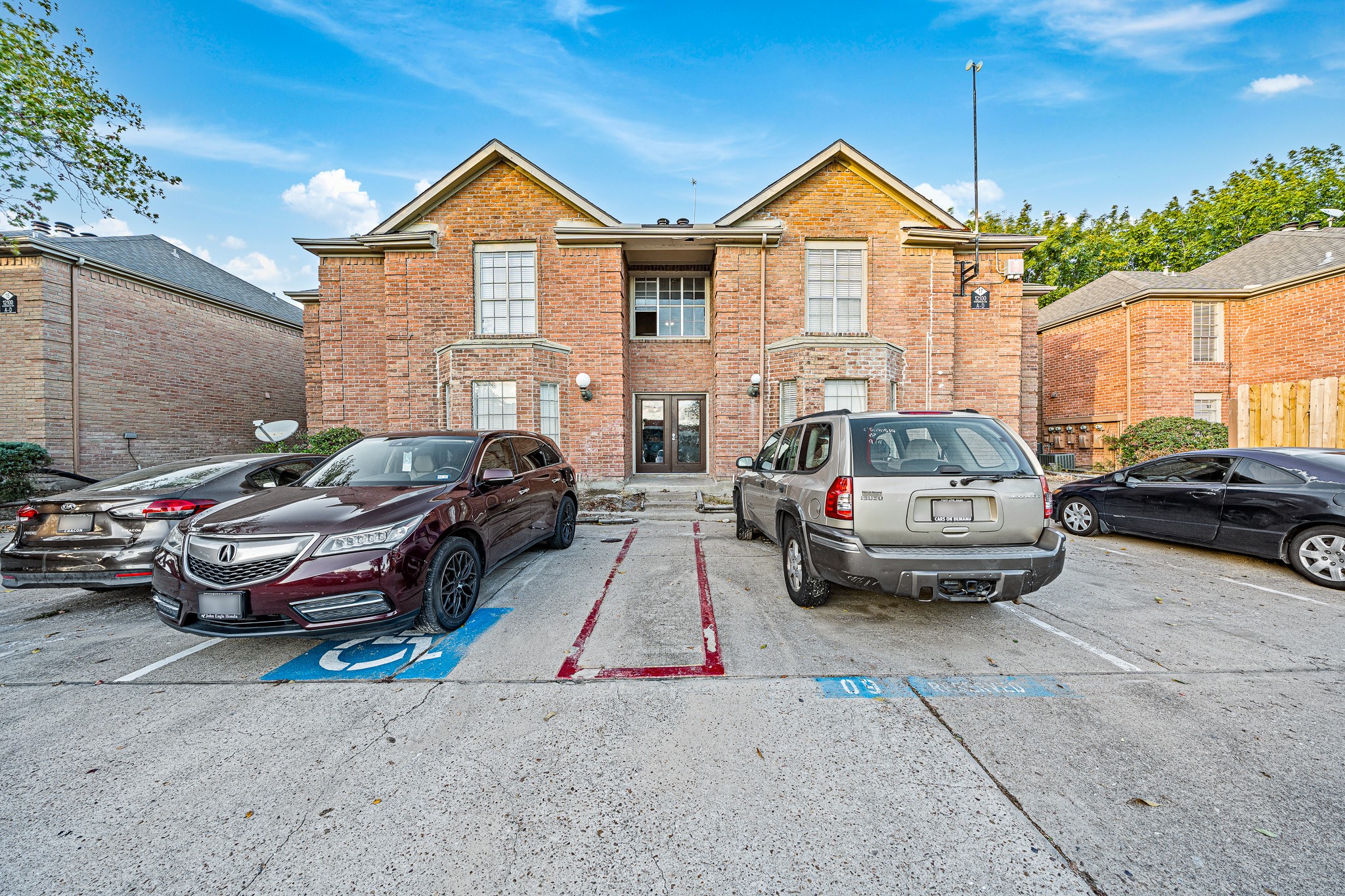 12100 Overbrook Lane, Unit 17D Houston, TX 77077 - Photo 2 of 22 a car parked in front of a house