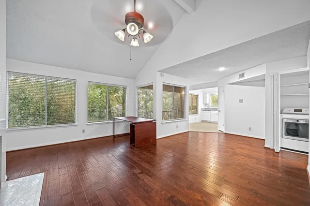 a view of livingroom with furniture wooden floor and window