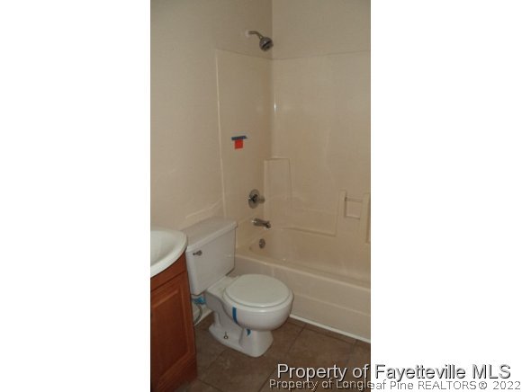 1145 Hoke Loop Road Fayetteville, NC 28314 - Photo 5 of 8 a bathroom with a toilet and a shower