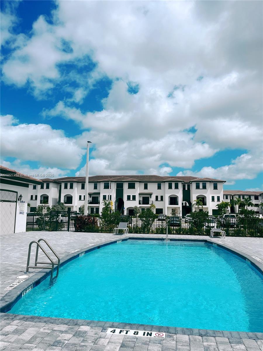 15650 Southwest 136th Street, Unit 218 Miami, FL 33196 - Photo 25 of 25 a view of a garden