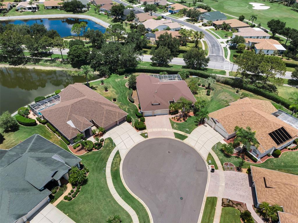 11917 Hadleigh Way Trinity, FL 34655 - Photo 52 of 84 an aerial view of a house with a garden and lake view