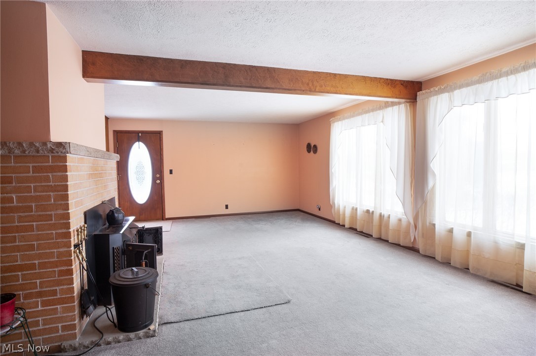 11 Pacific Road Northeast Carrollton, OH 44615 - Photo 22 of 46 So much natural light in the living room