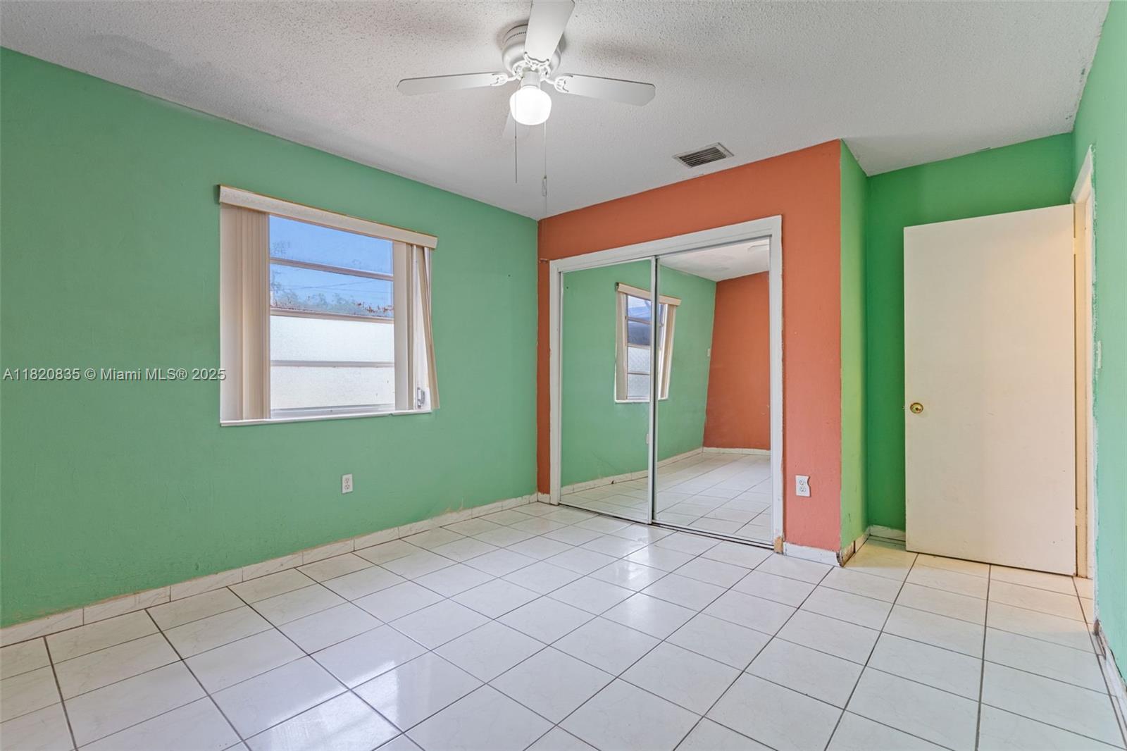 2920 Southwest 37th Court Miami, FL 33134 - Photo 13 of 48 a view of an empty room with window and fan