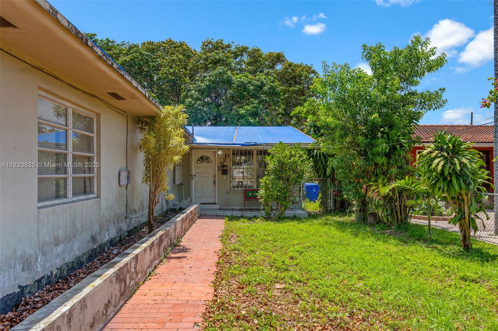 2920 Southwest 37th Court Miami, FL 33134 - Photo 17 of 48 a view of a house with backyard and sitting area