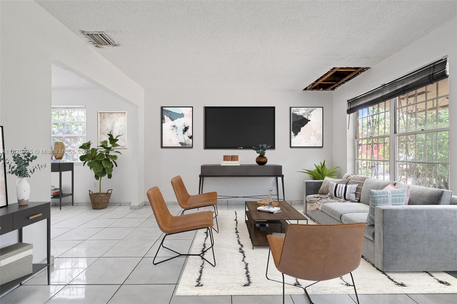 2920 Southwest 37th Court Miami, FL 33134 - Photo 18 of 48 a living room with furniture a flat screen tv and a large window