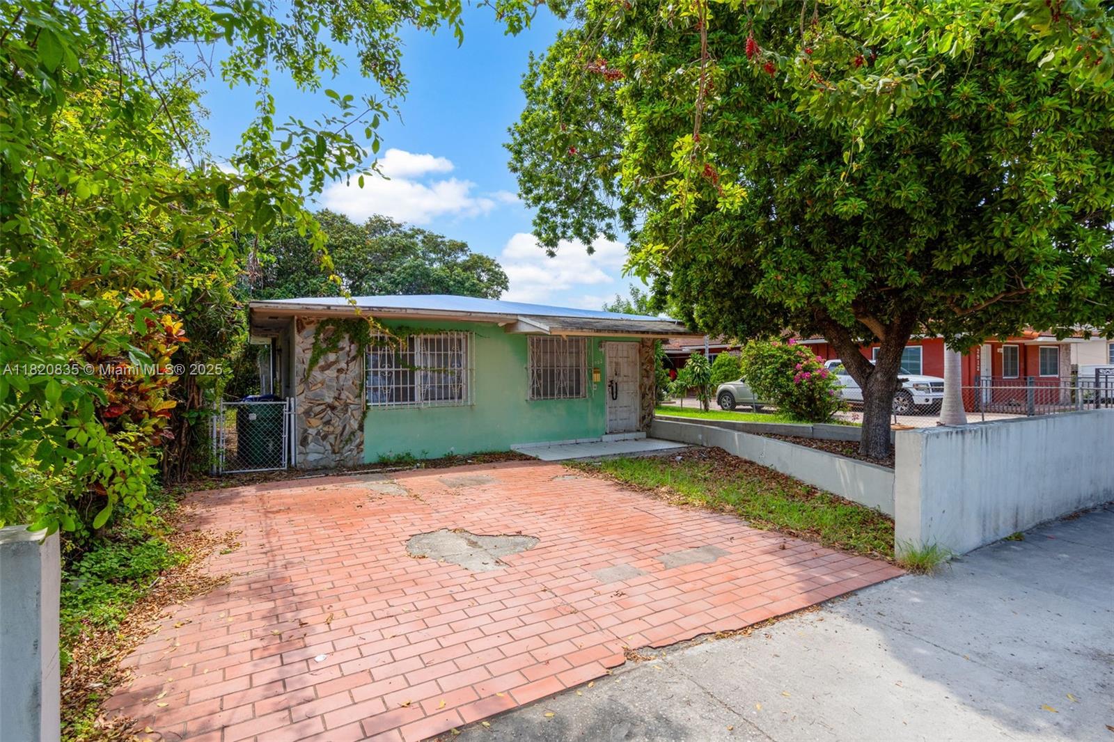 2920 Southwest 37th Court Miami, FL 33134 - Photo 2 of 48 front view of a house with a patio