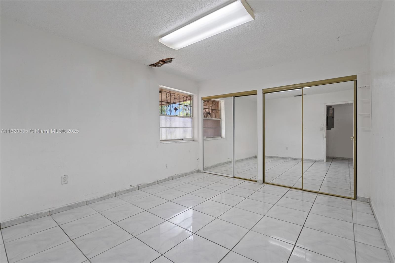 2920 Southwest 37th Court Miami, FL 33134 - Photo 30 of 48 a view of an empty room and window