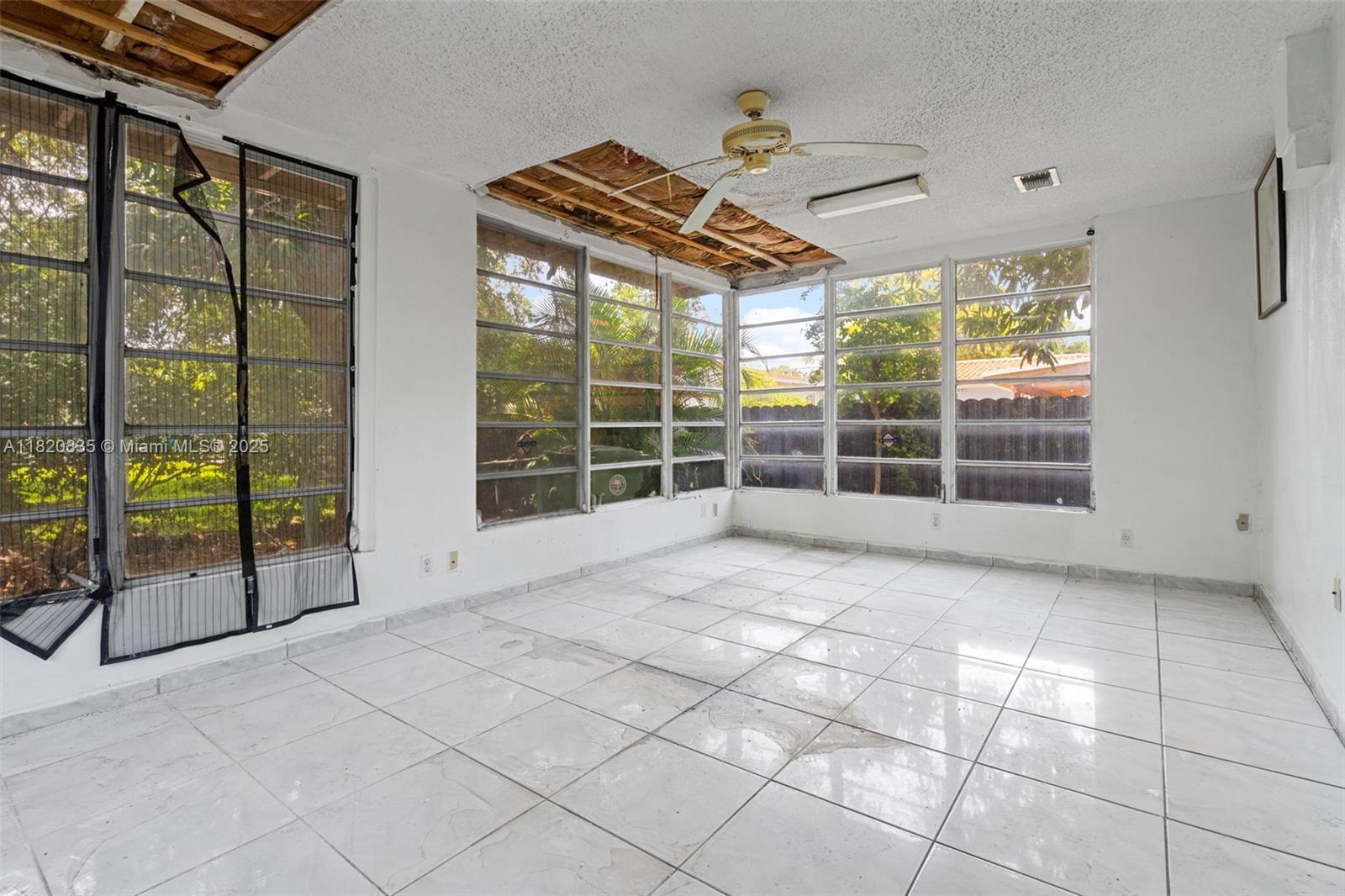 2920 Southwest 37th Court Miami, FL 33134 - Photo 39 of 48 a view of a room with tiles and windows