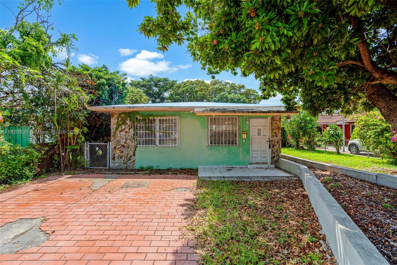 2920 Southwest 37th Court Miami, FL 33134 - Photo 4 of 48 a front view of a house with garden