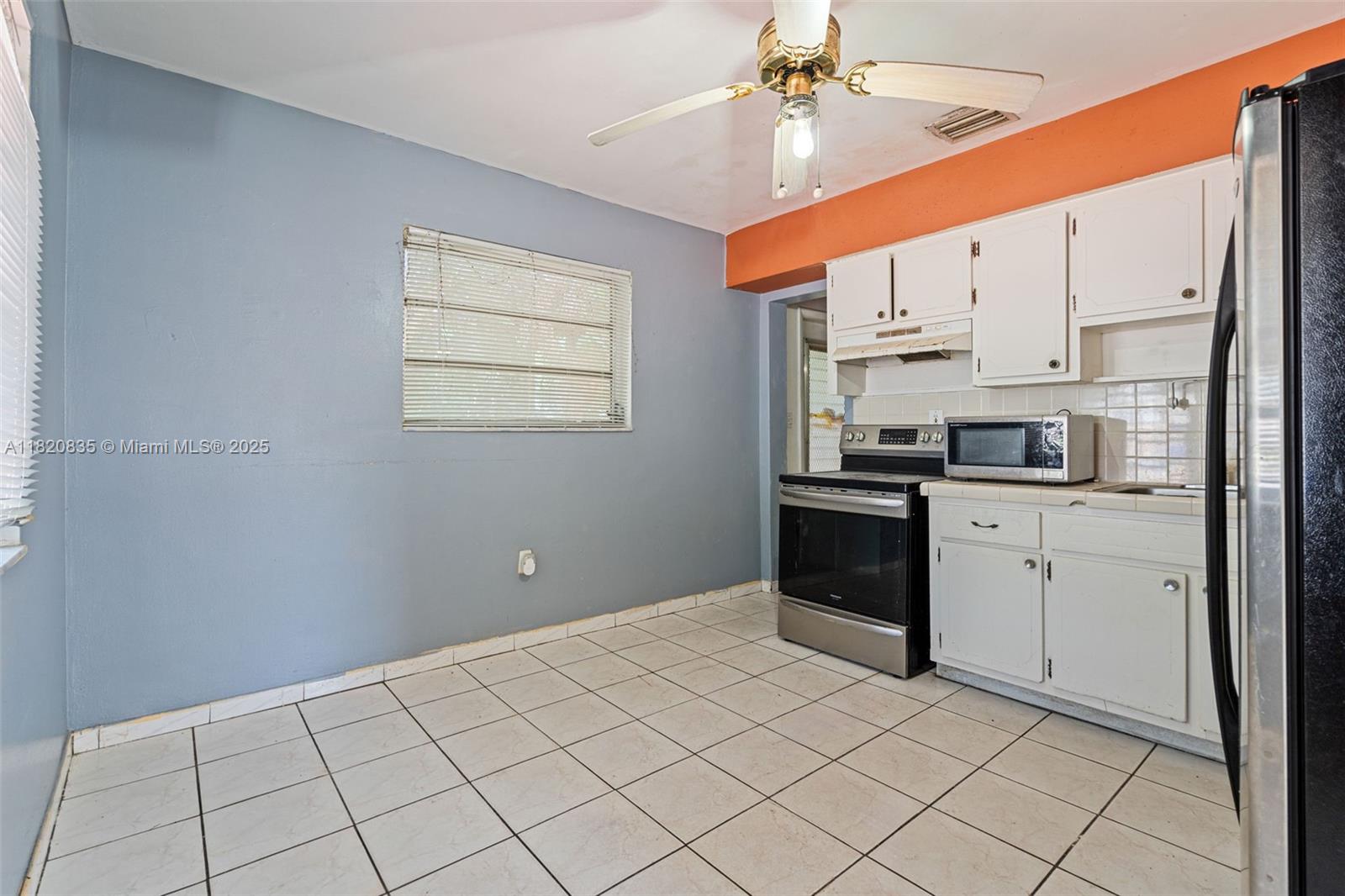 2920 Southwest 37th Court Miami, FL 33134 - Photo 8 of 48 a kitchen with a white cabinets and white appliances