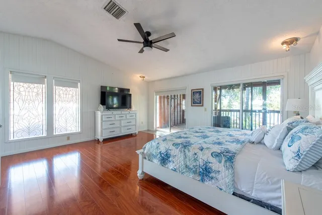a bedroom with furniture and window