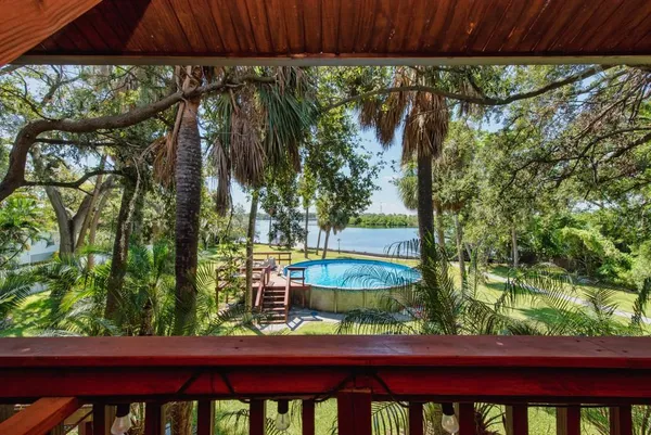 a view of a swimming pool with a patio