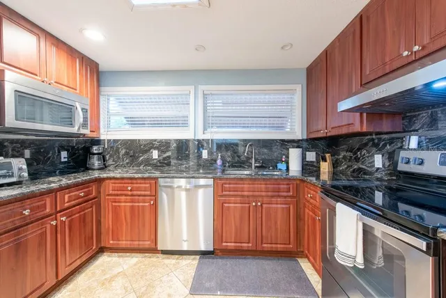a view of wooden floor and lake from a balcony