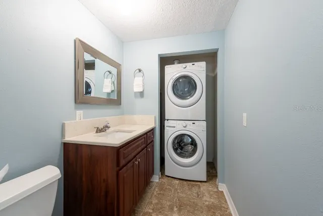 a aerial view of a house with a yard and plants